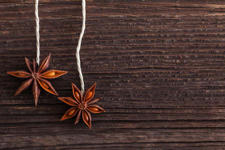 star anise on wooden background with copy spaceの写真素材