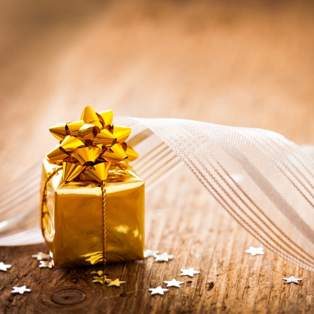 present with ribbon on wood with copy spaceの写真素材