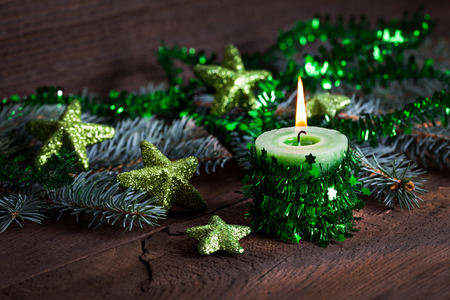 green candle for christmas with decoration の写真素材