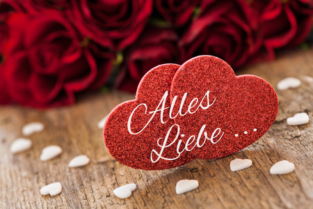 two heart shapes with german text alles Liebeの写真素材