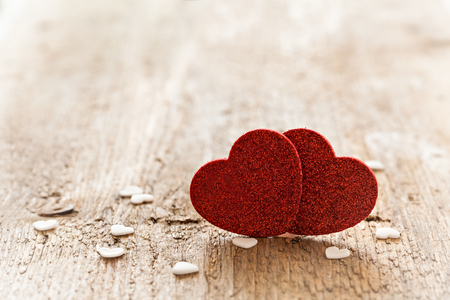two heart shapes on wood with copy space の写真素材