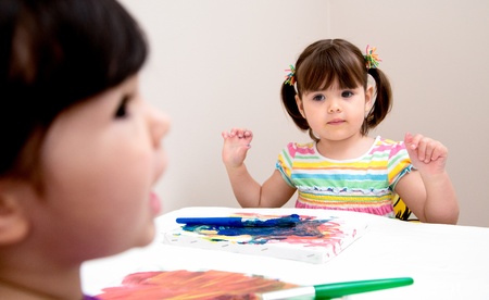 Young artist looks to her sister for painting advice