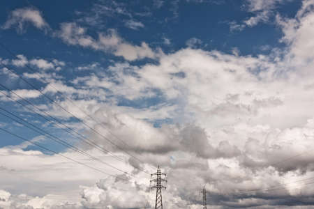 Almost Storm cloudscape with power pylons at bottomの写真素材