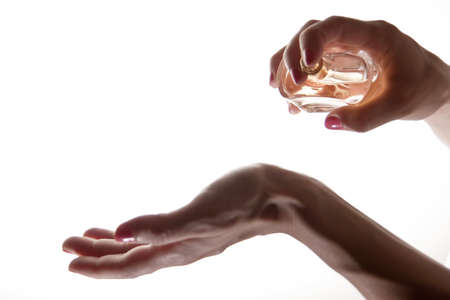 Picture of Woman applying perfume on her wrist の写真素材