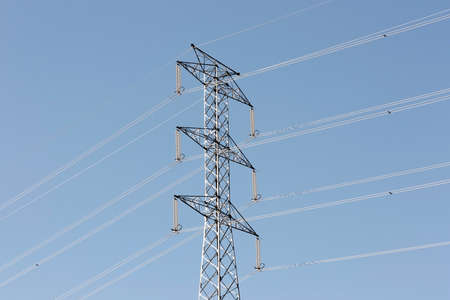 Power line and Electricity Pylon with against blue sky 
