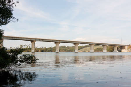 Highway Bridge across Mondego River , in Portugal, against landscapeの写真素材
