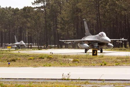 MONTE REAL, PORTUGAL-APRIL 7: 2 Portuguese F16 taxing. Participating in Real Thaw Nato exercise at...