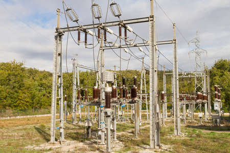 High Voltage Sub-Station against sky and woods