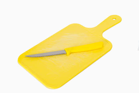 Scratched yellow board with knife of same colorの写真素材