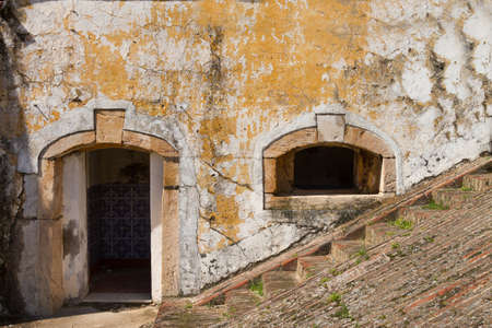 Stone facade of abandoned building with stairway alongの写真素材