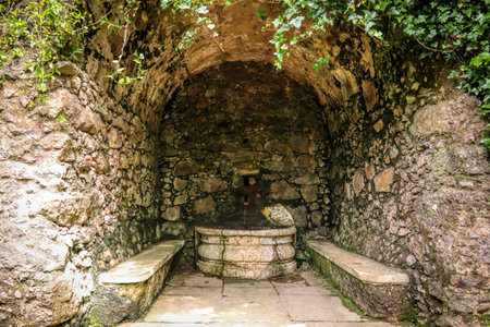Old stone fountain in the ruins of a medieval fortress in the village of Rovinj, Croatiaの写真素材