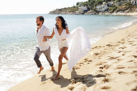 Beautiful stylish couple just married, have escape in Greece in summer time, perfect sunny day.の写真素材