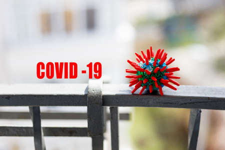 Virus Pandemic Concept. Abstract virus strain model of respiratory syndrome coronavirus with text on blurry background.の写真素材