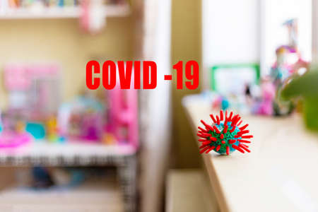 Symbol represents of a pandemic Coronavirus -Covid-19, located on a metal surface in room.の写真素材