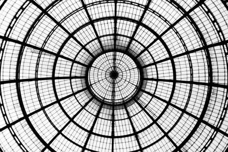 Horizontal view. Look up at glass dome in the Galleria Vittorio Emanuele II in Milan. Geometric...