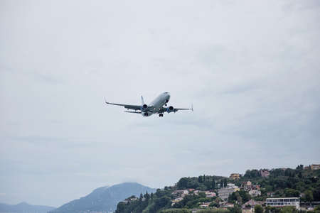 Horizontal view. Passenger plane, ready to land. Fly in the air.の写真素材