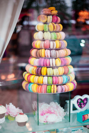 Pyramid of colorful macarons in a shop-window.の写真素材