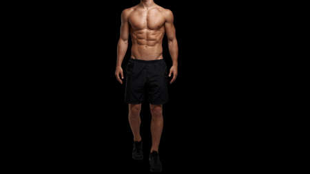 Cropped image a sportive man with muscular body, naked torso posing at studio. Black background. Mens health.の写真素材