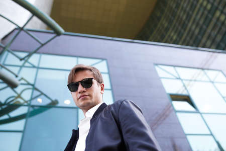 Handsome man in sunglasses. Outdoor male portrait.の写真素材