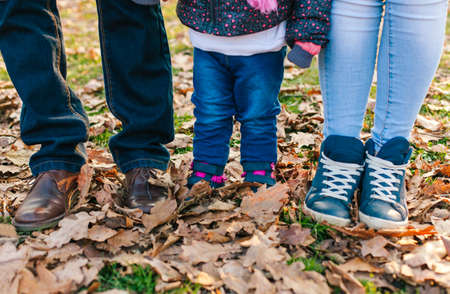 Family legs standing outdoor. Father child and motherの写真素材