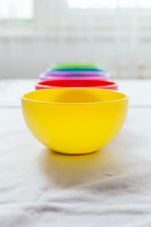 Closeup of colorful bowls with copy spaceの写真素材