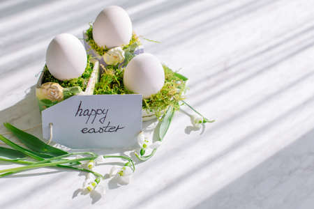 Easter concept. Happy Easter greeting card with eggs and flowers