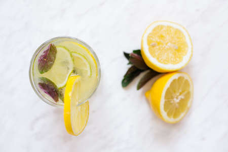 Top view of lemonade on white on marble slabの写真素材