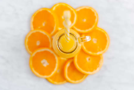 Fresh orange juice in jar glass, top viewの写真素材