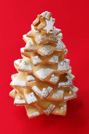 christmas tree cookie on red backgroundの写真素材