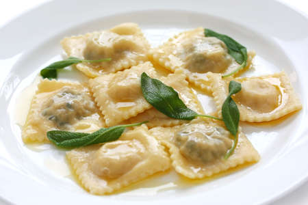 homemade ravioli pasta with sage butter sauce , italian foodの写真素材