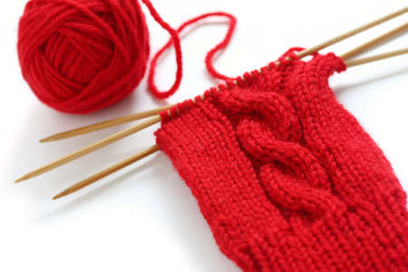 knitting image, a red yarn ball with noodlesの写真素材
