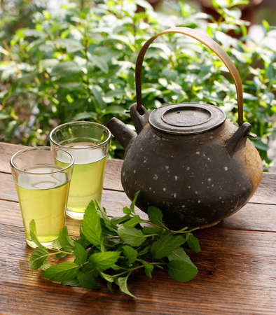 japanese teapot and green herbal teaの写真素材