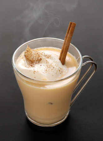 steaming eggnog on a black backgroundの写真素材