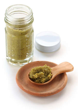 a bottle of yuzukosho, japanese condiment, yuzukosho is a fermented condiment that made from grated...