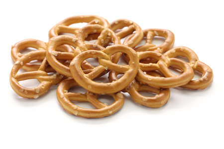 a pile of crispy pretzels on white background, american snack