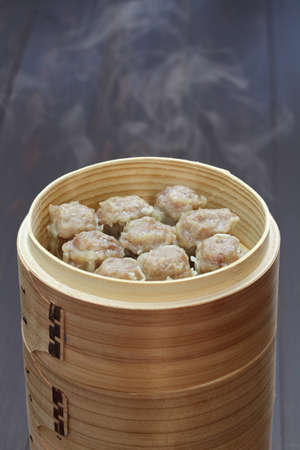 shu mai, shao mai, chinese food in bamboo steamerの写真素材