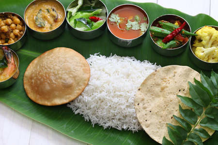 meals served on banana leaf, traditional south indian cuisineの写真素材