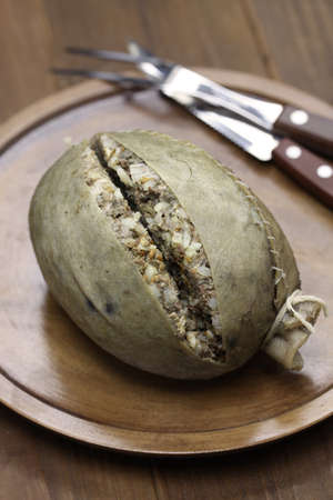 homemade haggis, scotland food isolated on wooden backgroundの写真素材