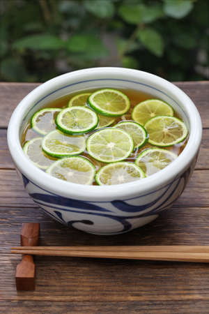 sudachi soba buckwheat noodles with sliced japanese citrus, japanese food