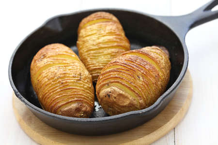 hasselback potatoes on skillet, swedish food