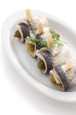 homemade rollmops, rolled pickled herring fillets