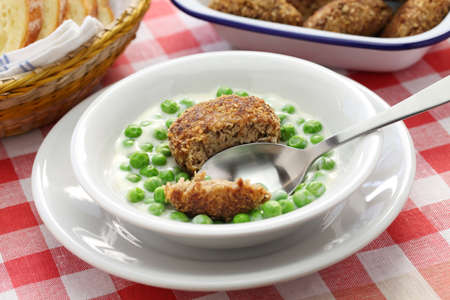 green peas fozelek thich vegetable stew and fasirt fried meatball, hungarian cuisine