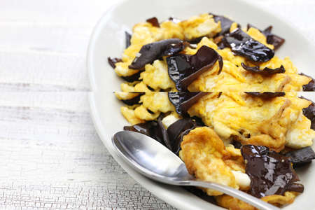stir fried eggs with wood ear mushrooms, chinese cuisineの写真素材
