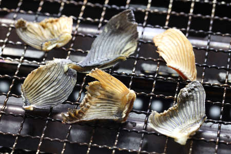 grilling dried blowfish fins for Hirezake (japanese hot sake drink).の写真素材