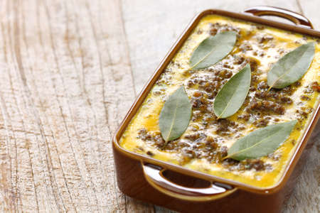 bobotie is a curry flavored meatloaf with baked egg on top.の写真素材