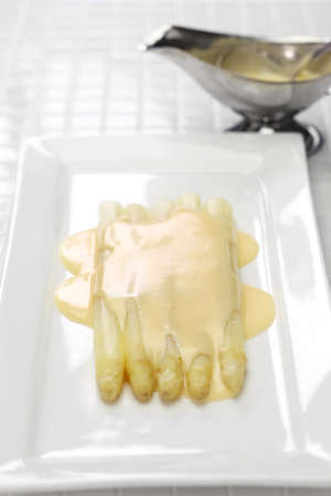 white asparagus with hollandaise sauceの写真素材