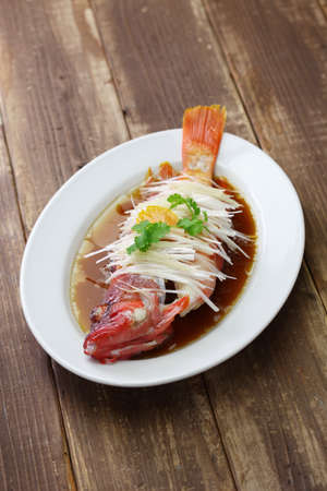 Chinese steamed red grouper with ginger, scallions and soy sauce