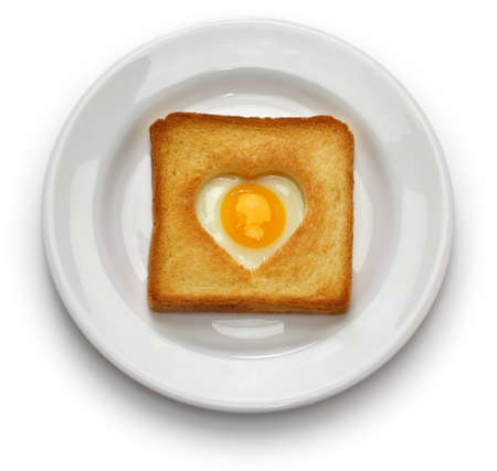 Egg in a hole of bread then toast that also known known as egg in the basket.の写真素材