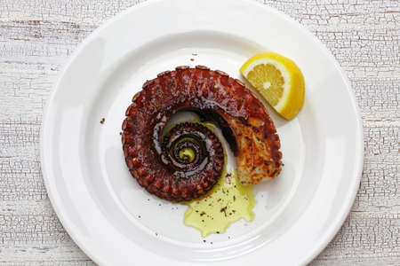 grilled extractus with lemon and olive oil, mediteranine cuisine ( Greece, Italy, Spain)