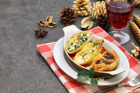 Conchiglioni (jumbo shell pasta ) stuffed with ragu, ricotta cheese and spinach. Italian food